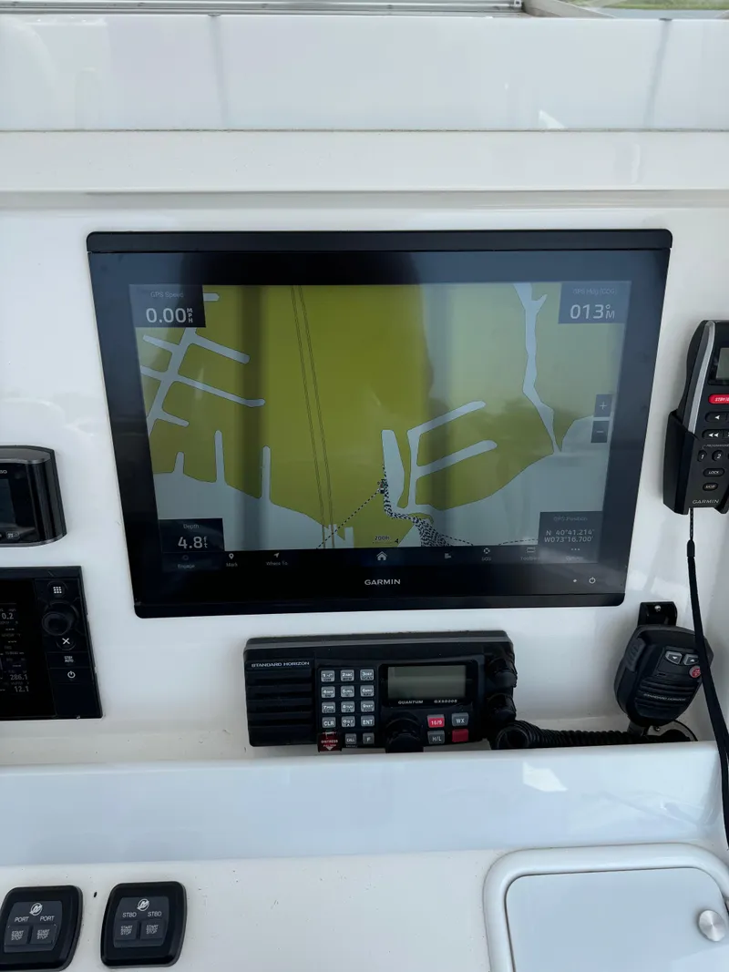 Slide: The Image of 2018 Invincible 43 Open Fisherman navigation system with Garmin display and marine radio. - 14
