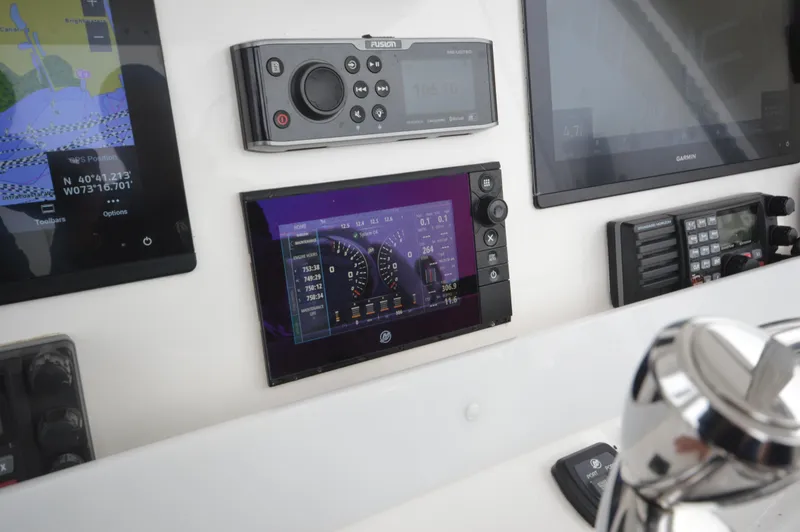 Slide: The Image of Control panel of a 2018 Invincible 43 Open Fisherman boat with navigation and communication systems. - 15