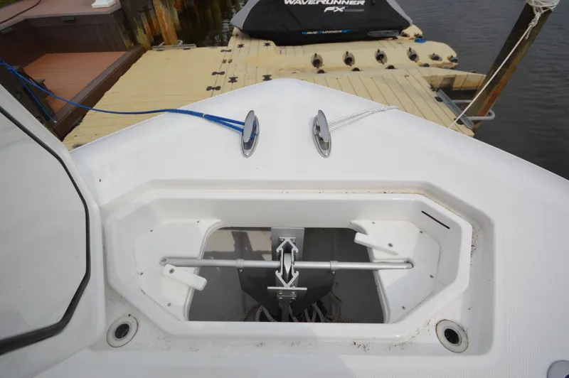 Slide: The Image of Anchor storage compartment on 2018 Invincible 43 Open Fisherman boat at dock. - 17