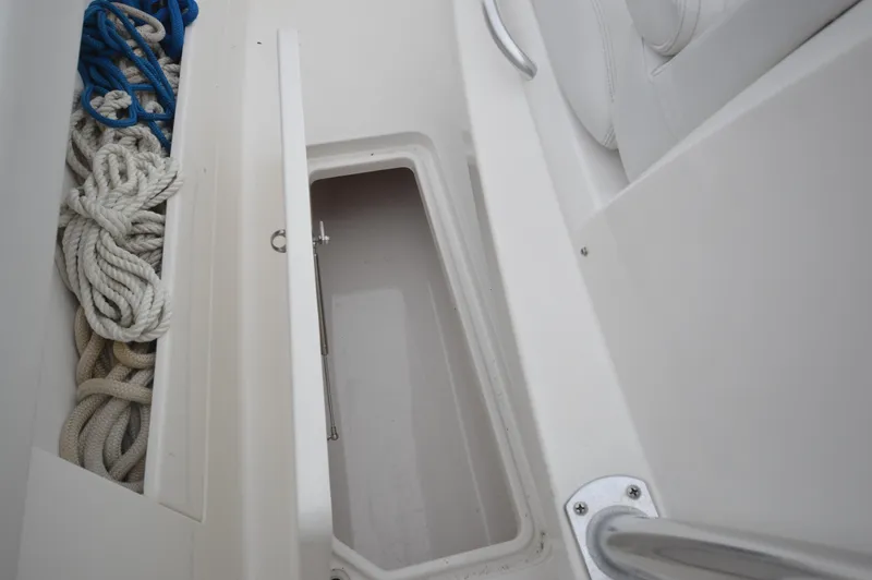 Slide: The Image of Storage compartment on 2018 Invincible 43 Open Fisherman boat with ropes. - 19