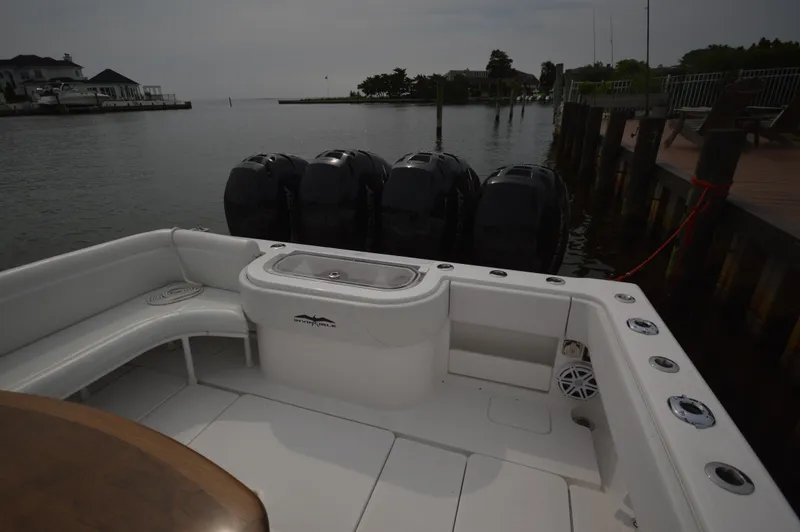 Slide: The Image of 2018 Invincible 43 Open Fisherman boat docked with quad outboard engines. - 21