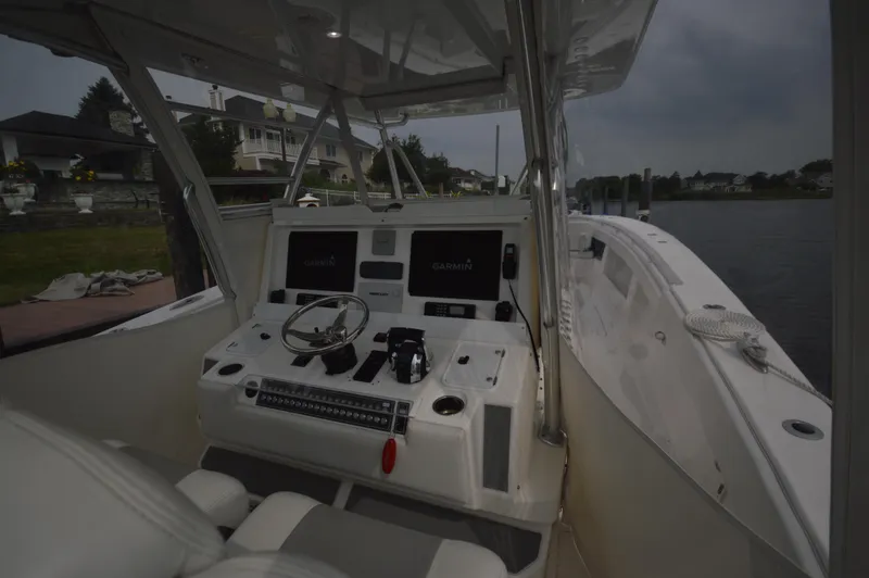 Slide: The Image of 2018 Invincible 43 Open Fisherman boat cockpit with advanced navigation systems. - 24