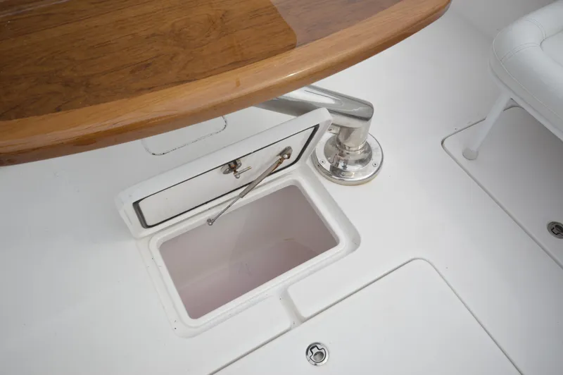 Slide: The Image of 2018 Invincible 43 Open Fisherman boat interior storage compartment and table. - 35