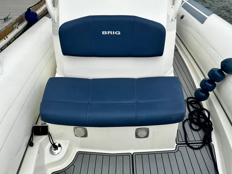 Slide: The Image of 2022 Brig Eagle 8 boat with blue seating and sleek deck design. - 12