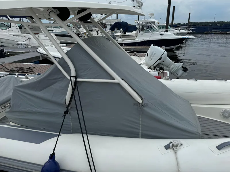 Slide: The Image of 2022 Brig Eagle 8 boat with cover, docked at marina. - 17