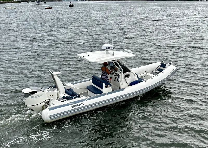 Slide: The Image of 2022 Brig Eagle 8 boat cruising on water with Suzuki outboard engine. - 18