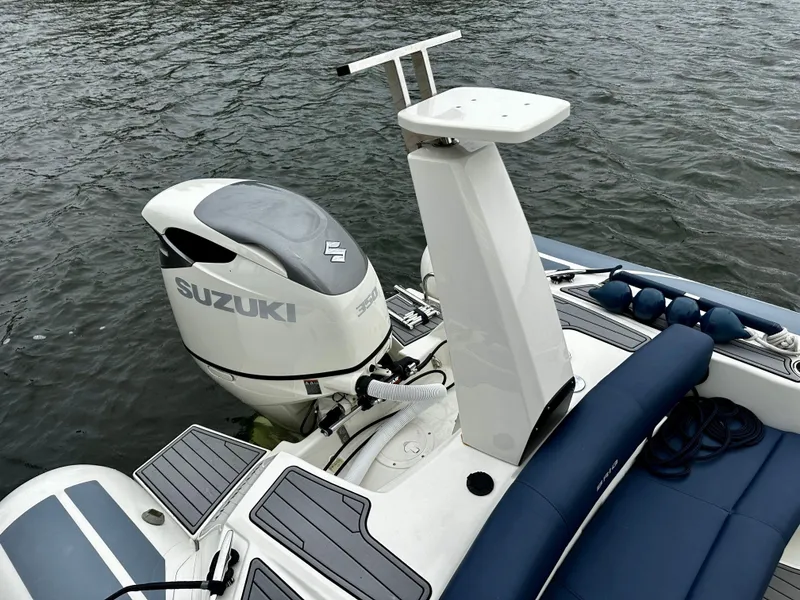 Slide: The Image of 2022 Brig Eagle 8 boat with Suzuki outboard motor on water. - 4