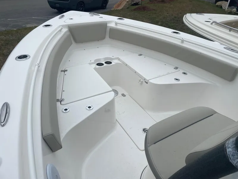 Slide: The Image of 2025 Key West 239 FS boat interior with seating and storage compartments. - 2