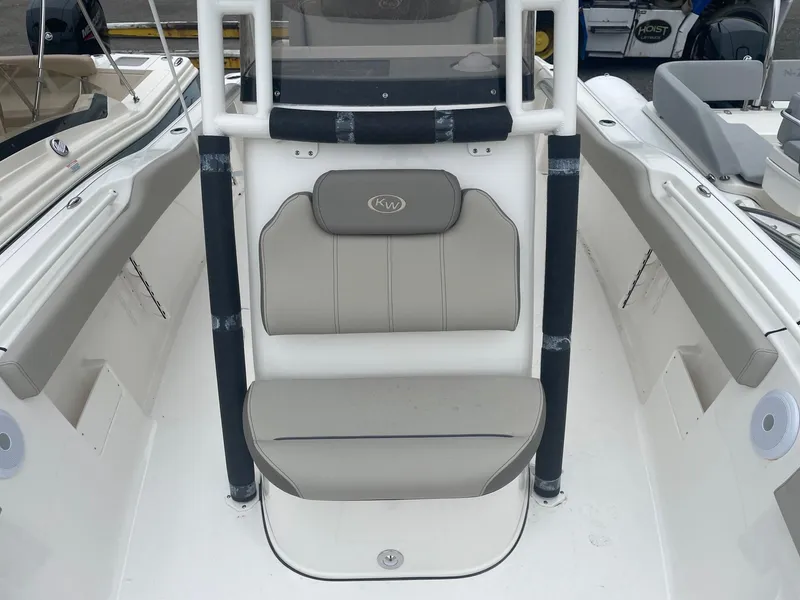 Slide: The Image of 2025 Key West 239 FS boat interior with cushioned seating and console. - 3