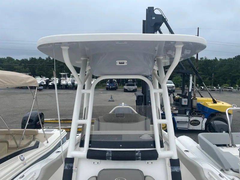 Slide: The Image of 2025 Key West 239 FS boat with T-top in a marina. - 4
