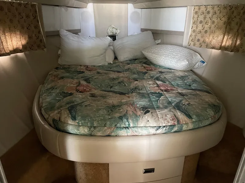Slide: The Image of 1997 Formula 40 boat cabin with bed and pillows. - 12
