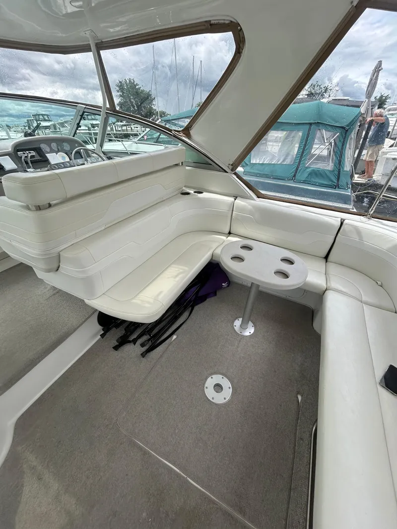 Slide: The Image of 1997 Formula 41 PC boat interior with white seating and small table. - 18
