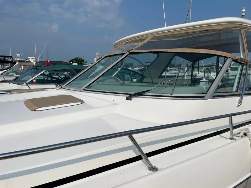 Slide: The Image of 1997 Formula 40 boat docked at a marina on a sunny day. - 5