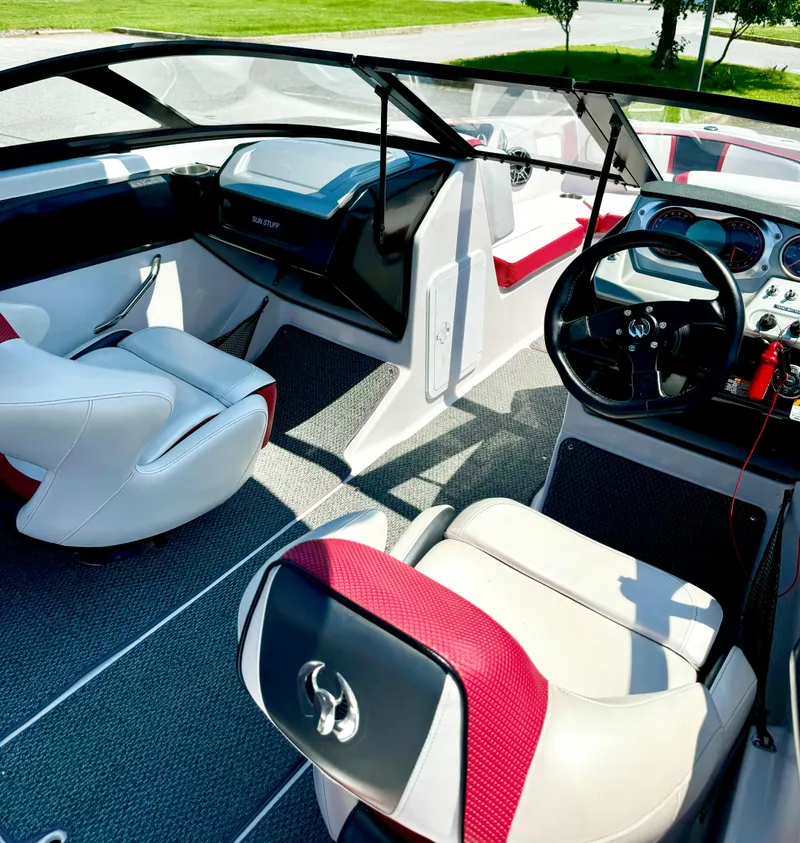 Slide: The Image of Interior of 2015 Scarab 215 HO Impulse boat with modern dashboard and seating. - 15