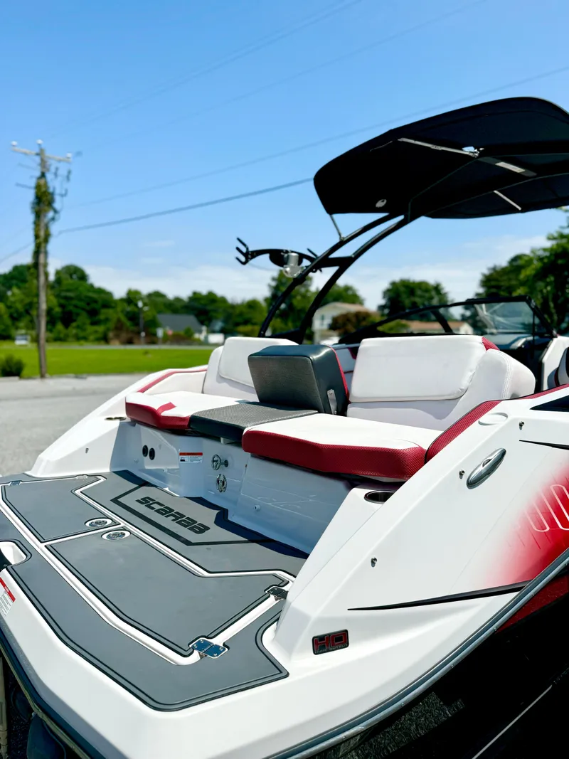 Slide: The Image of 2015 Scarab 215 HO Impulse boat with sleek design and comfortable seating. - 25