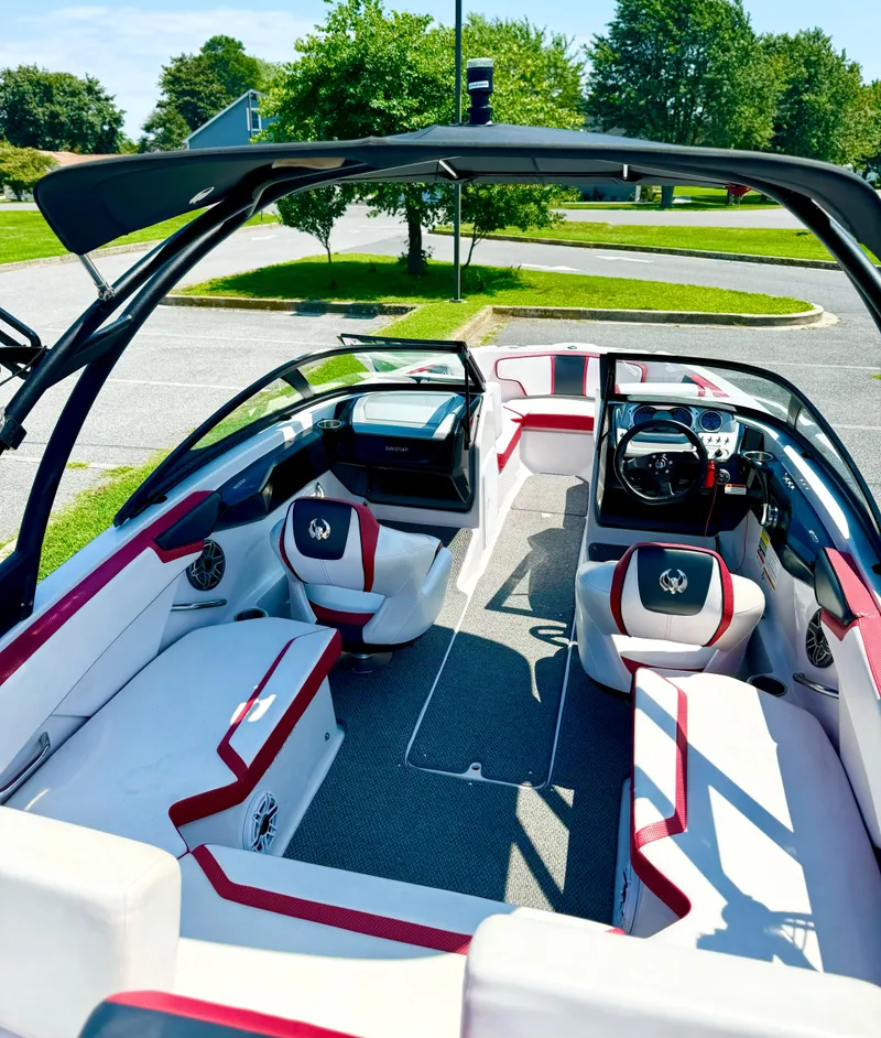 Slide: The Image of 2015 Scarab 215 HO Impulse boat interior with stylish seating and modern dashboard. - 27