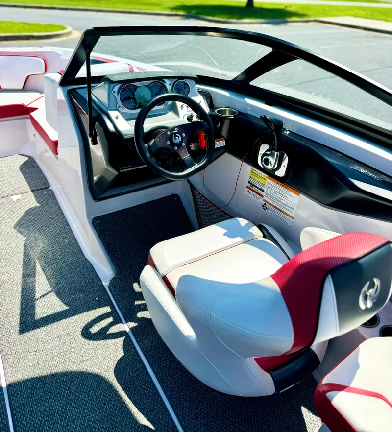 Slide: The Image of Interior of 2015 Scarab 215 HO Impulse boat with modern dashboard and seating. - 28