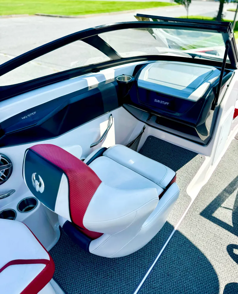 Slide: The Image of Interior of 2015 Scarab 215 HO Impulse boat with red and white seating. - 29