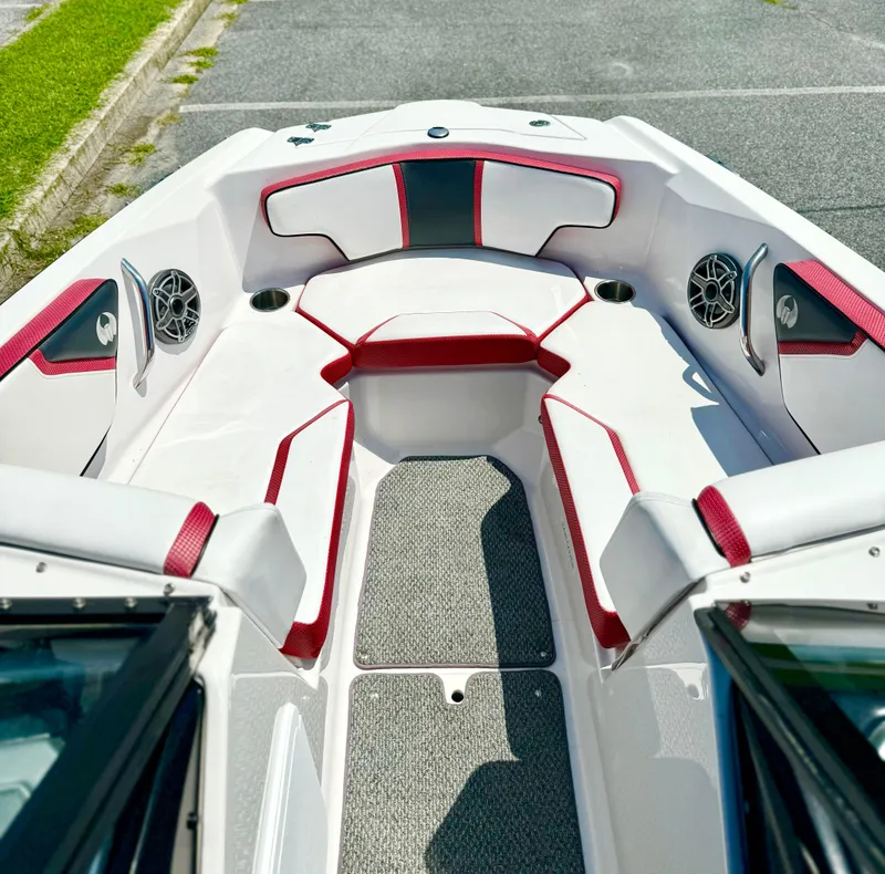 Slide: The Image of 2015 Scarab 215 HO Impulse boat interior with red and white seating. - 30