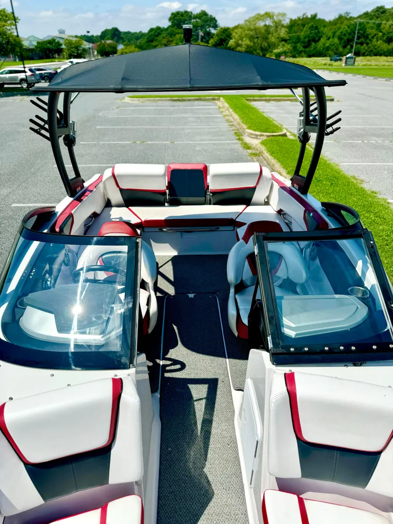 Slide: The Image of 2015 Scarab 215 HO Impulse boat with sleek design and spacious seating. - 31