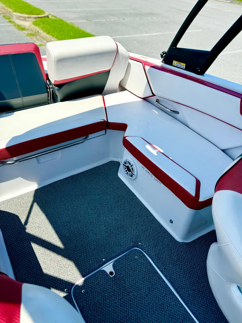 Slide: The Image of 2015 Scarab 215 HO Impulse boat interior with red and white seating. - 34