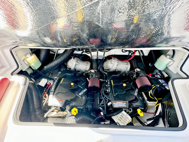 Slide: The Image of 2015 Scarab 215 HO Impulse engine compartment with dual Rotax engines. - 36