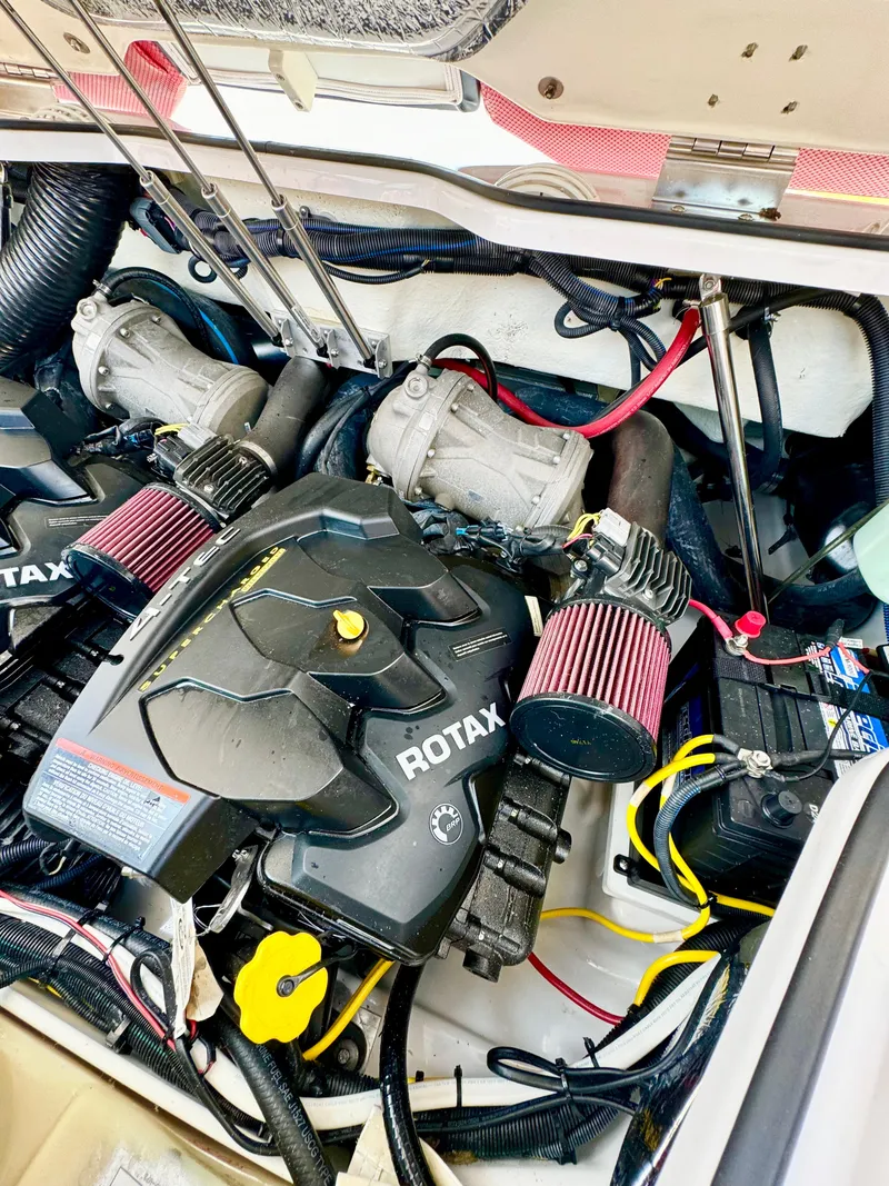 Slide: The Image of 2015 Scarab 215 HO Impulse engine compartment with Rotax engine components. - 37