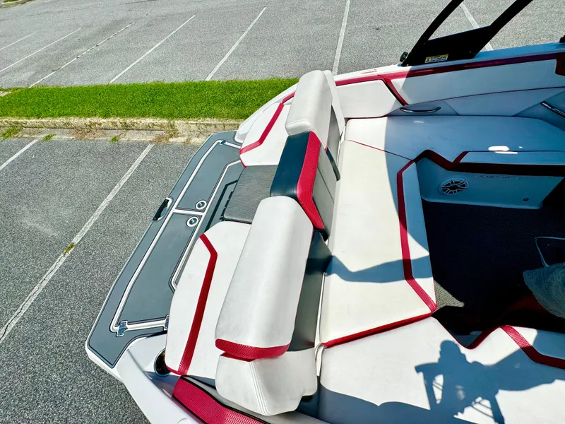 Slide: The Image of 2015 Scarab 215 HO Impulse boat interior with red and white seating. - 8