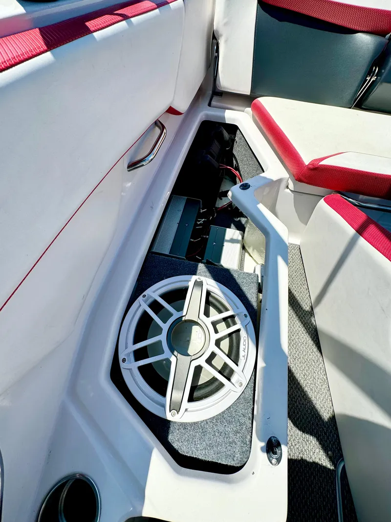 Slide: The Image of 2015 Scarab 215 HO Impulse boat interior with speaker and seating. - 9