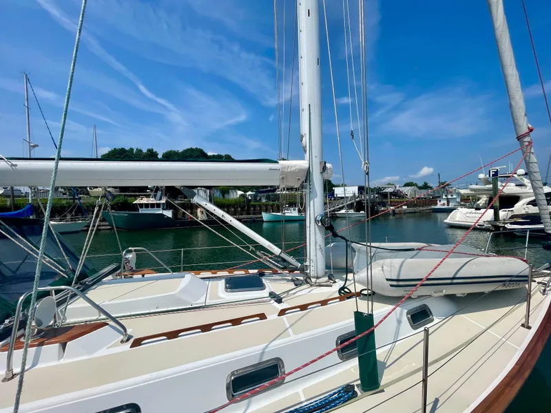 Slide: The Image of Sailboat Tartan 4100, 2001 model, docked in a sunny marina. - 11