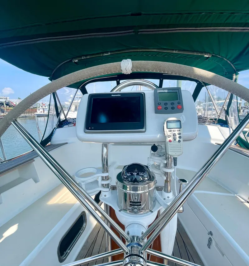 Slide: The Image of Tartan 4100 yacht cockpit with navigation equipment and steering wheel, 2001 model. - 14