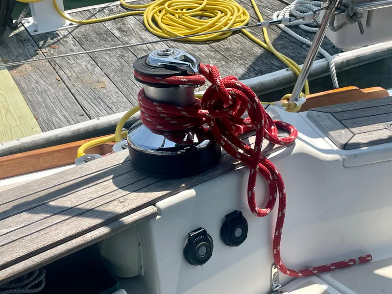 Slide: The Image of Tartan 4100 sailboat winch with red rope, docked, 2001 model. - 18