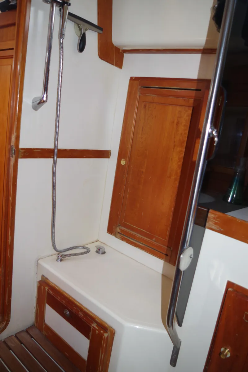 Slide: The Image of 2001 Tartan 4100 yacht bathroom with wooden cabinets and shower. - 39