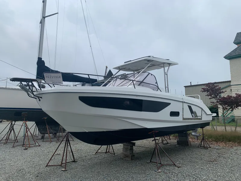 Slide: The Image of 2024 Beneteau Flyer 9 SUNdeck boat on stands in a marina. - 2