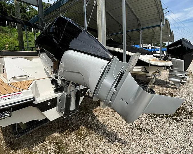 Slide: The Image of 2025 Sea Ray SPX 230 Outboard motor at a marina. - 13