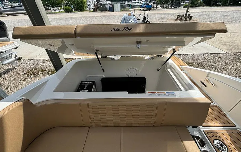 Slide: The Image of 2025 Sea Ray SPX 230 Outboard storage compartment with open lid. - 3