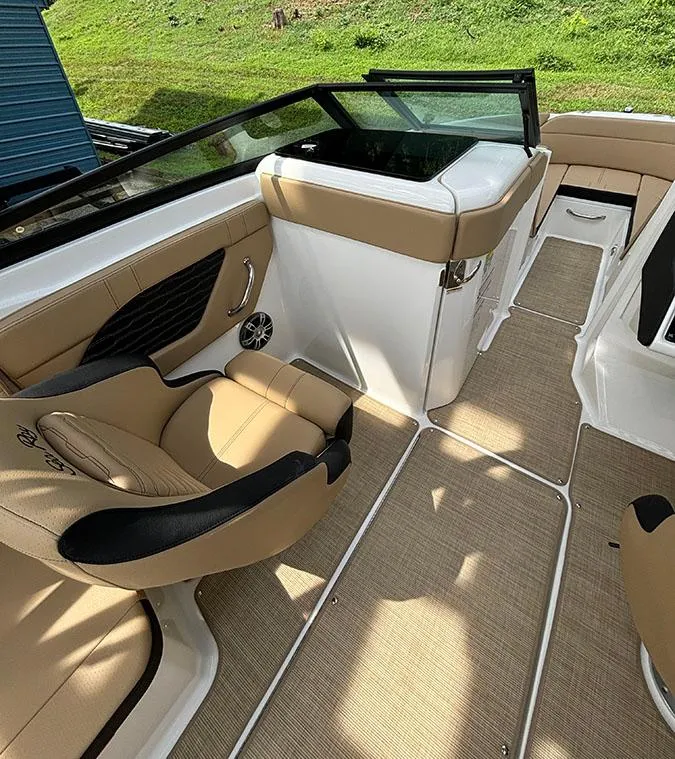 Slide: The Image of 2025 Sea Ray SPX 230 Outboard boat interior with tan and black seating. - 6