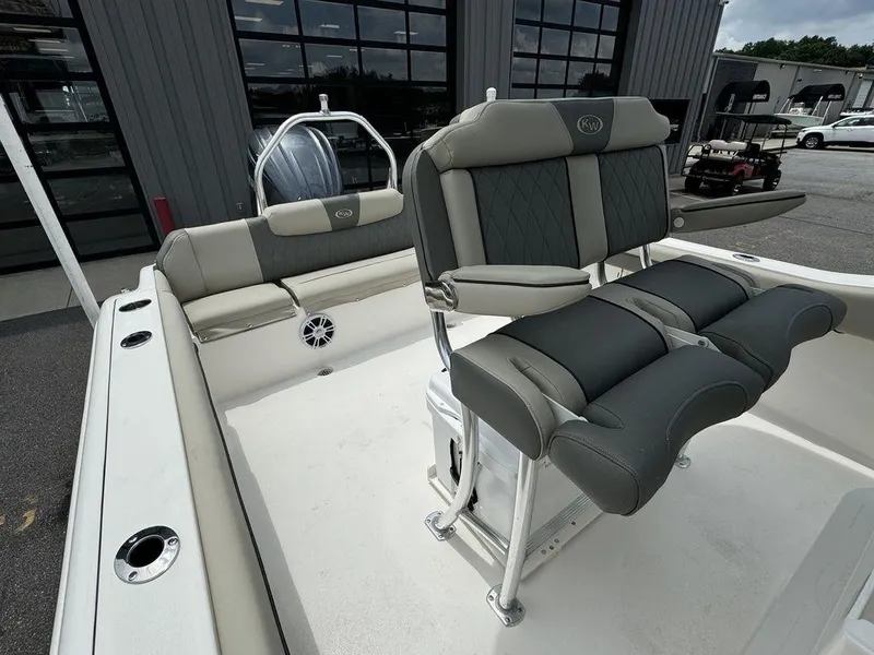 Slide: The Image of 2025 Key West 239FS boat interior with cushioned seating and modern design. - 10