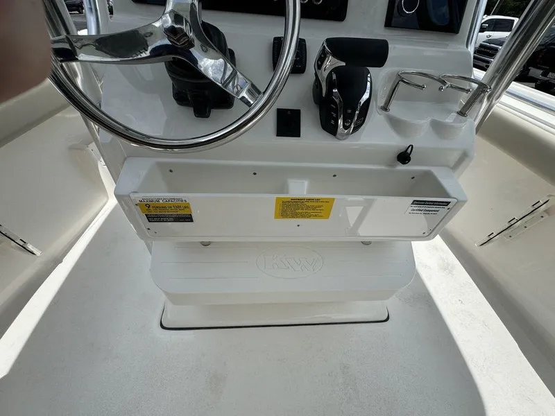 Slide: The Image of 2025 Key West 239FS boat console with steering wheel and controls. - 13