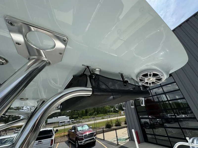 Slide: The Image of 2025 Key West 239FS boat with overhead storage and speaker system. - 19