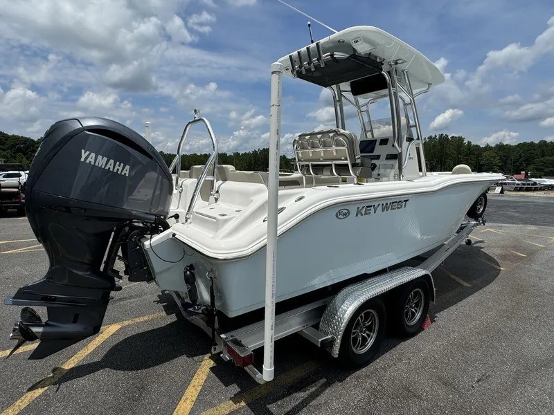 Slide: The Image of 2025 Key West 239FS boat on trailer with Yamaha outboard motor. - 2