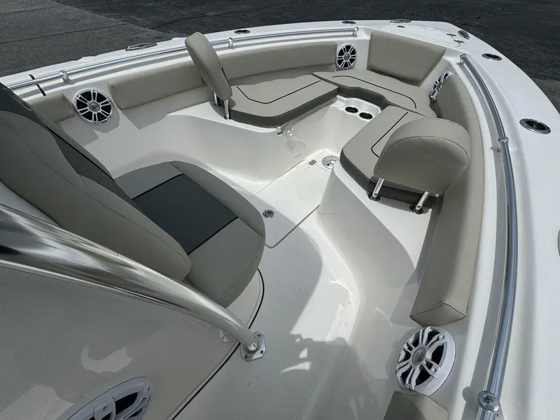 Slide: The Image of 2025 Key West 239FS boat interior with cushioned seating and built-in speakers. - 20