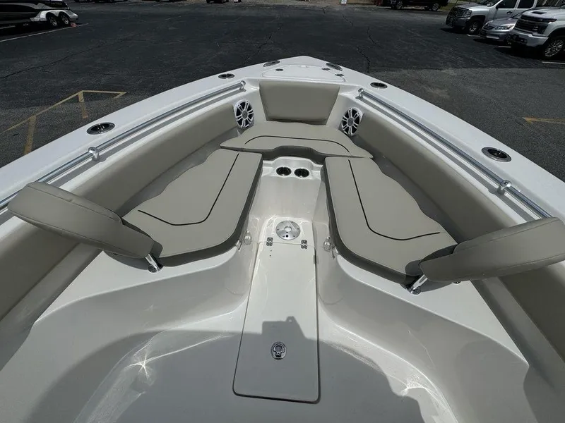 Slide: The Image of 2025 Key West 239FS boat interior with cushioned seating and cup holders. - 21