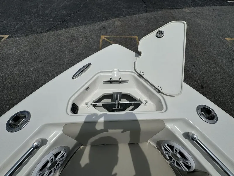 Slide: The Image of 2025 Key West 239FS boat anchor storage compartment with open hatch. - 23