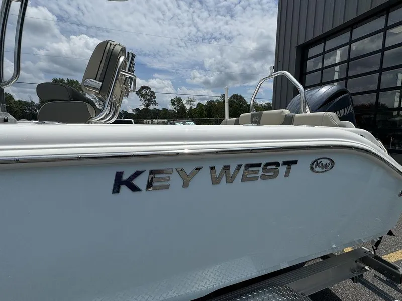 Slide: The Image of 2025 Key West 239FS boat side view with logo and seating. - 5