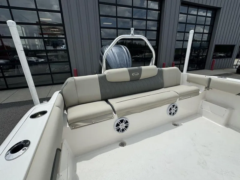 Slide: The Image of 2025 Key West 239FS boat interior with cushioned seating and speakers. - 8