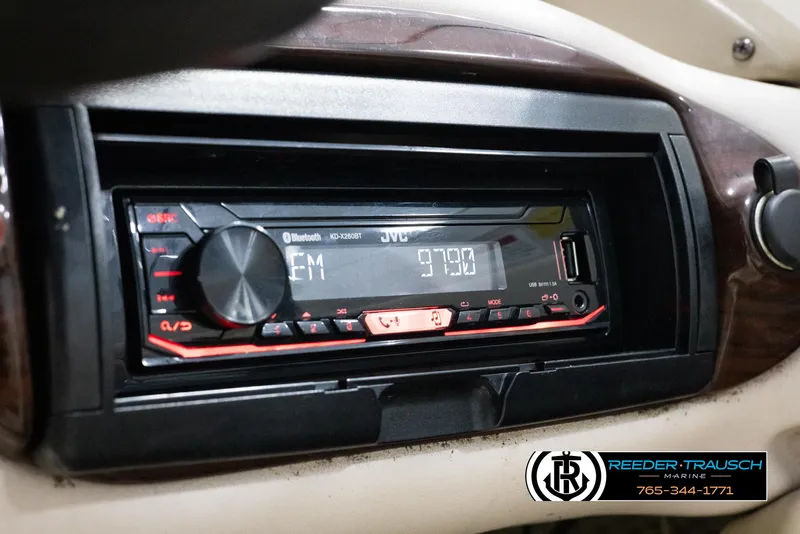 Slide: The Image of 2002 Larson LXI 210 boat dashboard with JVC stereo system. - 27