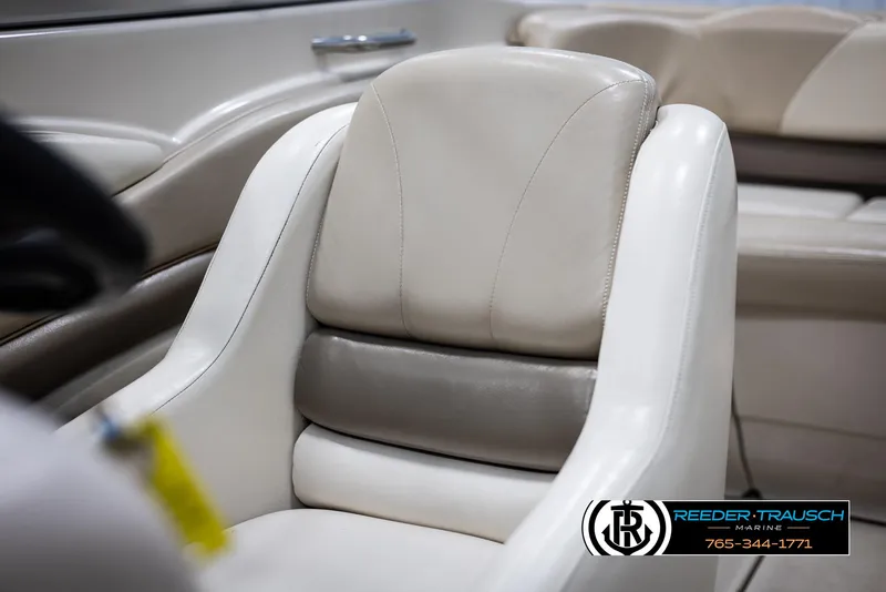 Slide: The Image of 2002 Larson LXI 210 boat interior seat, beige and white upholstery. - 28