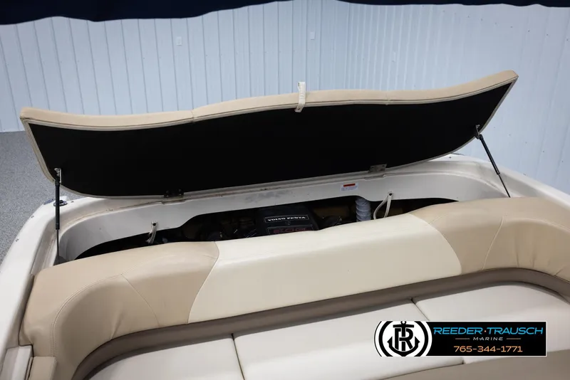 Slide: The Image of 2002 Larson LXI 210 boat with open engine compartment. - 35