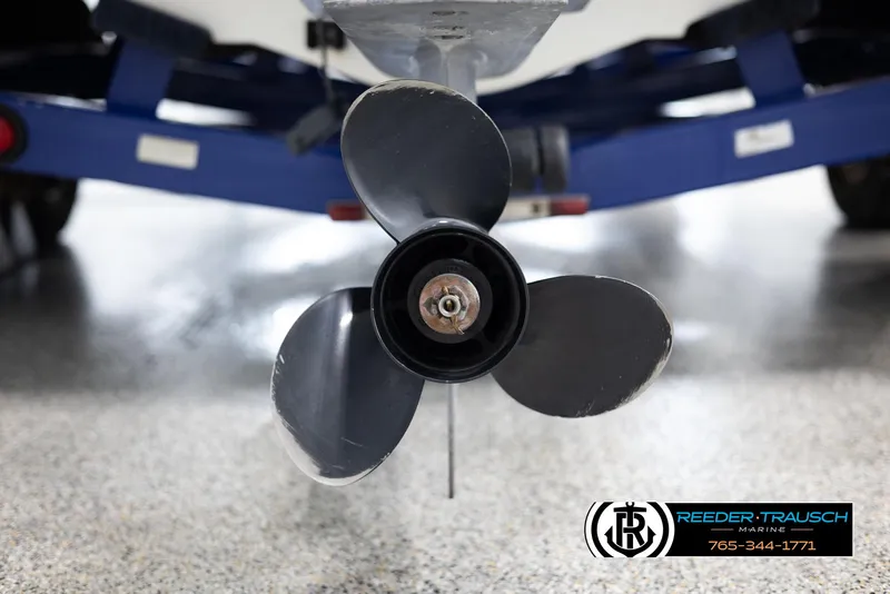 Slide: The Image of 2002 Larson LXI 210 boat propeller and trailer close-up. - 39